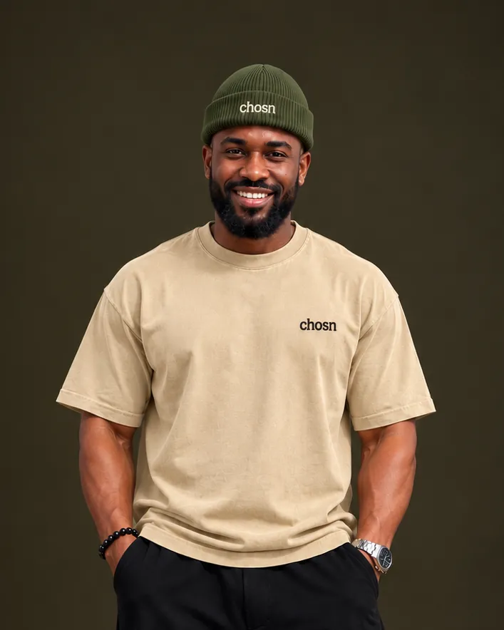 The chosn model in the olive Signature Rib Beanie and a sand Signature Tee
